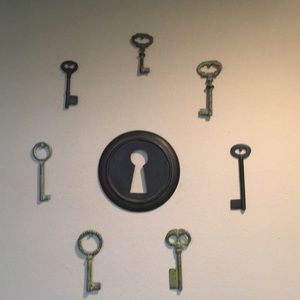 Old fashion keys and a cute wooden keyhole in excellent condition